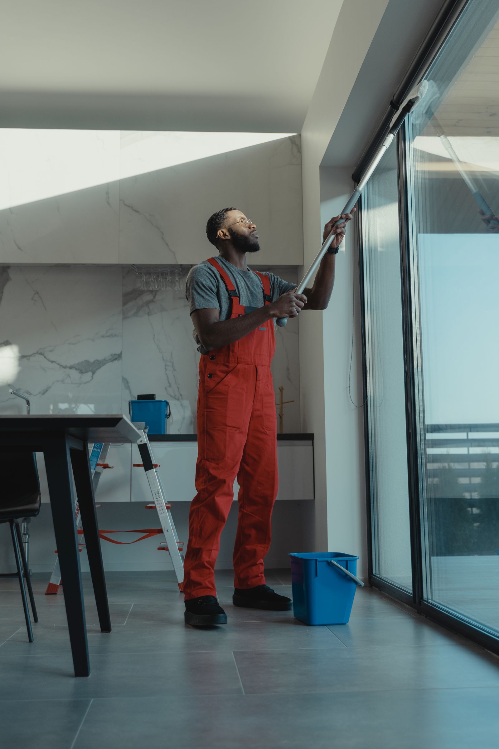 A professional cleaner working inside a home